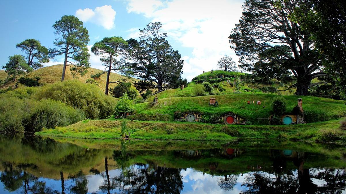 Hobbit holes reflected in water